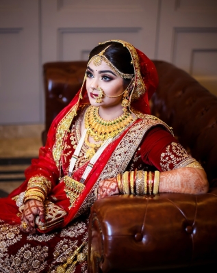 Photo by Farddin Protik httpswww.pexels.comphotowoman-in-red-sari-dress-siting-on-sofa-2106685